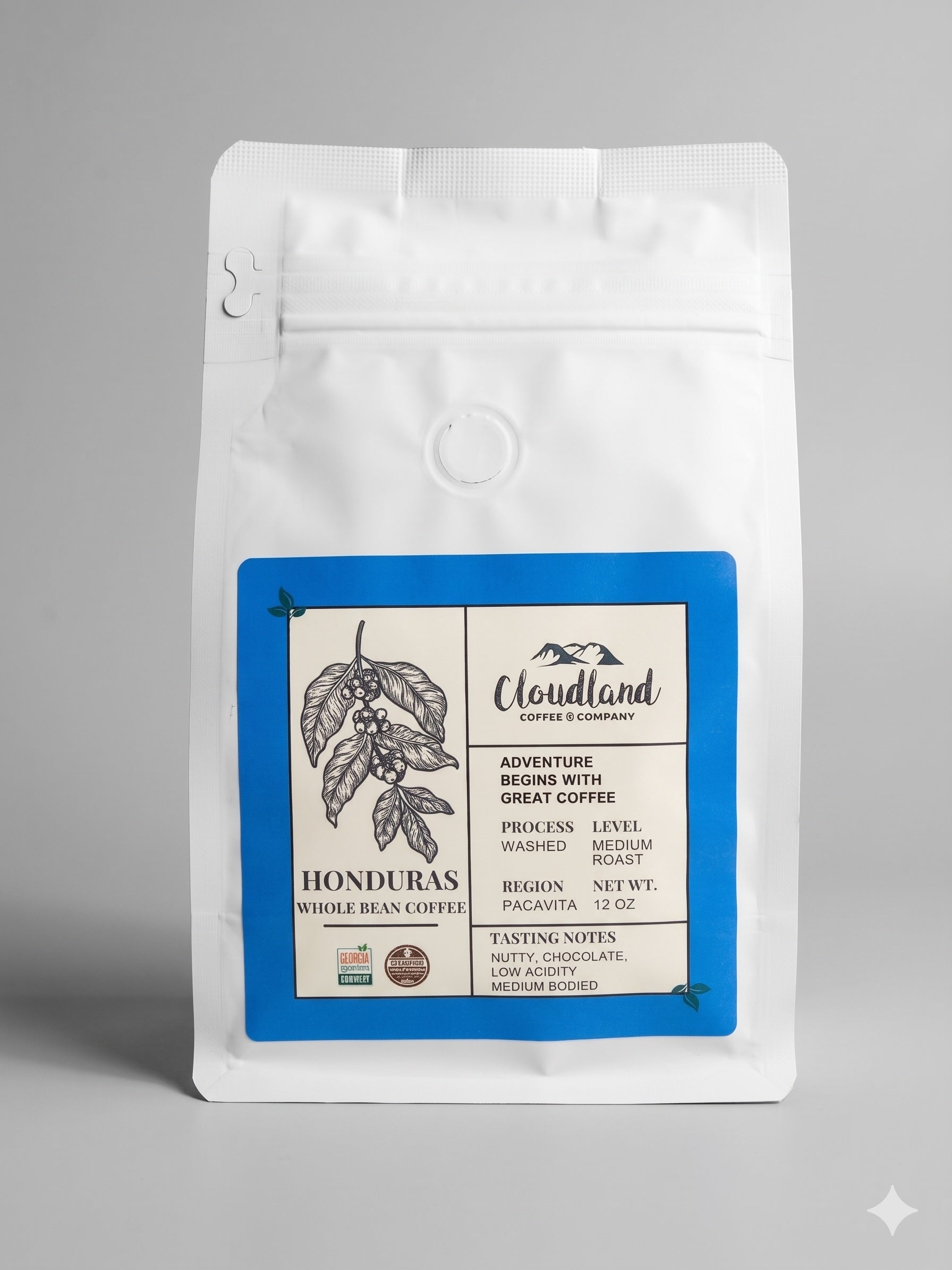 A bag of medium roasted whole bean coffee with a cup of coffee