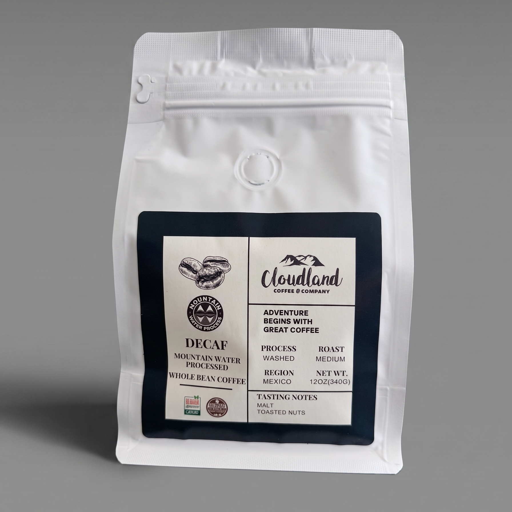 White coffee bag with a decaf coffee label on a gray background
