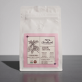 White coffee bag  of Ethiopian coffee with a pink label on a gray background